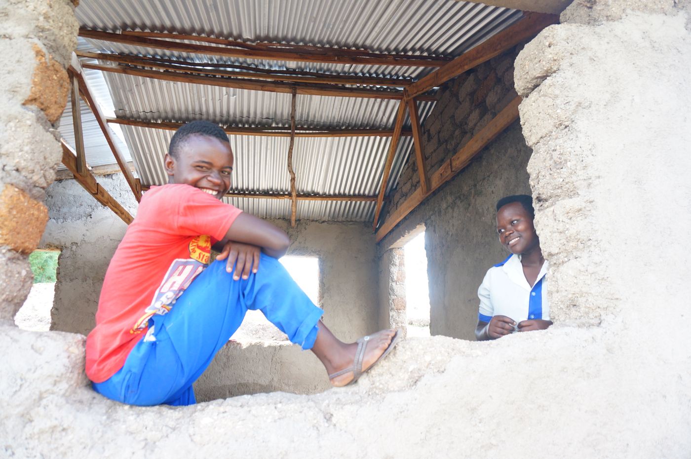 Students smiling in a new building